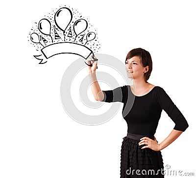 Young girl drawing a party label on whiteboard Stock Photo