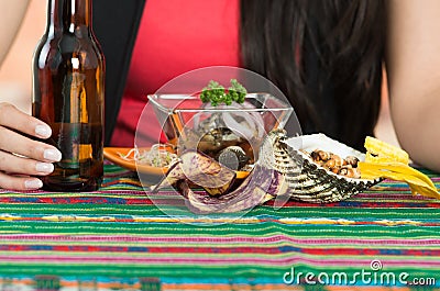 Young girl enjoying a seafood cebiche Stock Photo