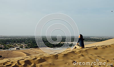 Young girl enjoying the view at Dunhuang desert, Gansu, China Stock Photo