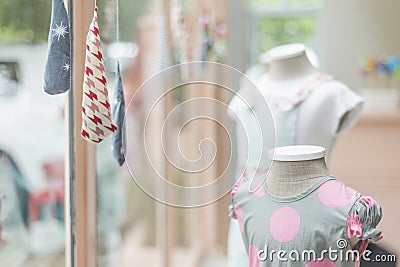 Young girl fashion dress in childrenswear fashion shop window Stock Photo