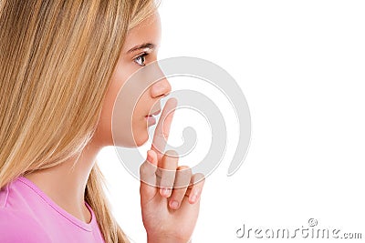 Young girl with finger on lips as concept of ordering silence i Stock Photo