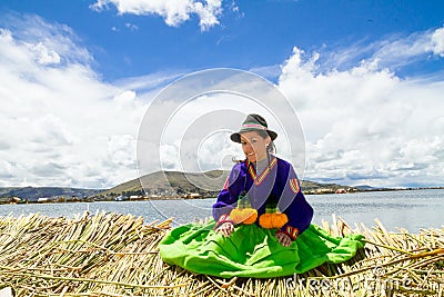 Young girl on a floating Uros island, Titicaca Stock Photo
