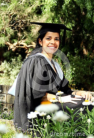 Young girl girl in a graduation gown. Stock Photo