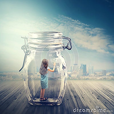 Young girl in a glass jar Stock Photo