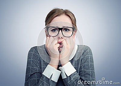 Young girl with glasses is very afraid. Deep fear concept Stock Photo