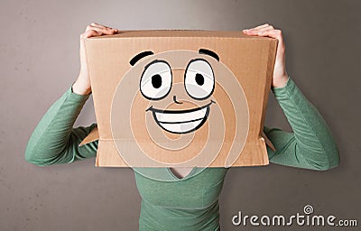 Young girl with happy cardboard box face Stock Photo