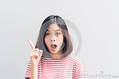 Young girl happy in red dress and is Point the finger. Concept summer travel Stock Photo