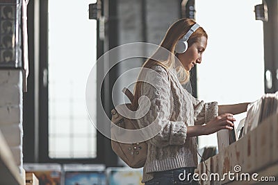 Young girl browsing vinyl records in a music store Stock Photo