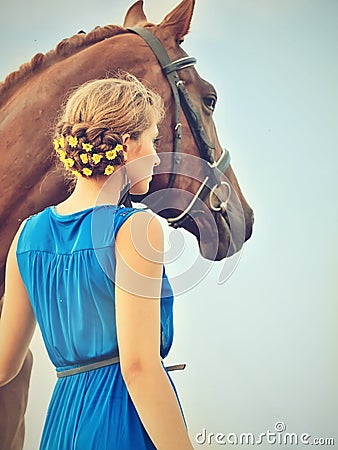 Young girl with her horse posing together Stock Photo