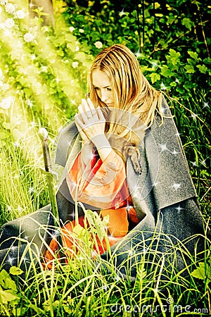 Young Girl On Her Knees Praying In Woods Royalty Free Stock Photo