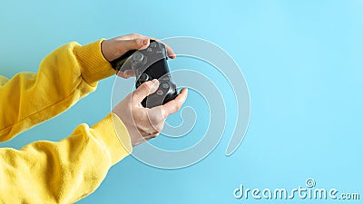Young girl holding black joystick in her hands Stock Photo