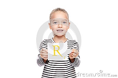 Young girl holding a card with letter R. Speech therapy concept on white background. Correct pronounciation and articulation. Stock Photo