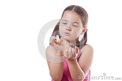 Young girl holding an open fortune cookie Stock Photo