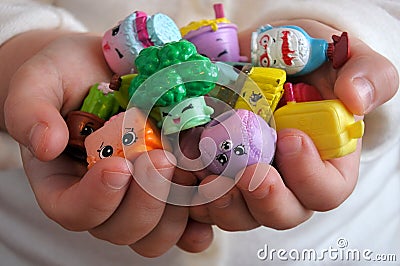 Young girl holding Shopkins collectable toys Editorial Stock Photo