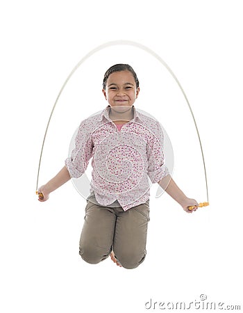 Young Girl Jumping with Skipping Rope Stock Photo