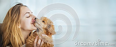 Young girl kissing her good friend dog . Stock Photo