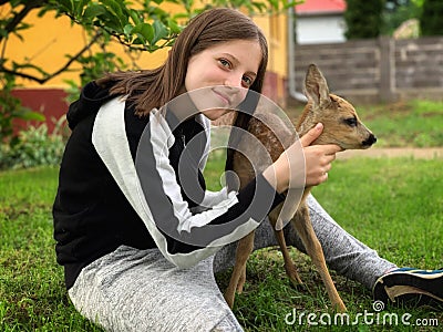 Young girl and a little deer Stock Photo