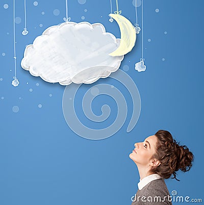 Young girl looking at cartoon night clouds with moon Stock Photo