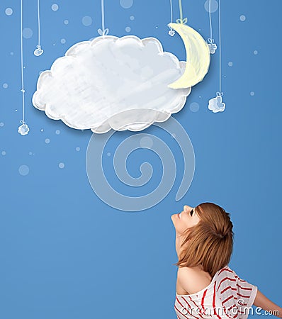 Young girl looking at cartoon night clouds with moon Stock Photo