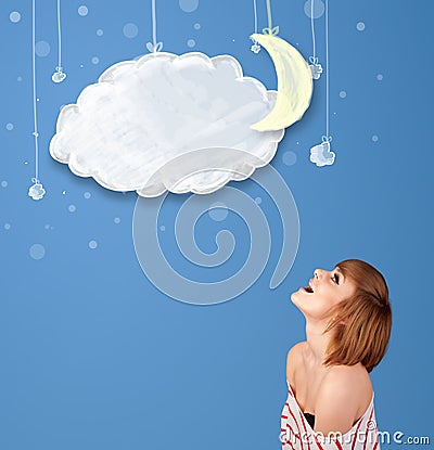 Young girl looking at cartoon night clouds with moon Stock Photo
