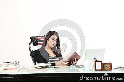 Girl is looking work in diary Stock Photo