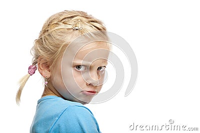 Young girl looks angry and offended in camera Stock Photo