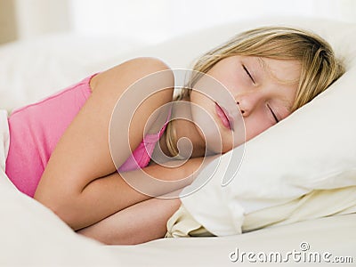 Young Girl Lying In Her Bed Stock Photo