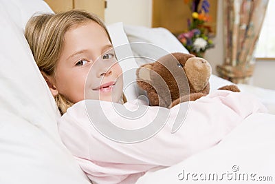 Young Girl Lying In Hospital Bed Stock Photo