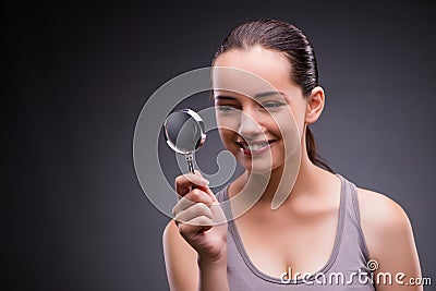 The young girl with magnifying glass Stock Photo