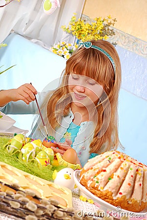 Young girl painting easter eggs Stock Photo