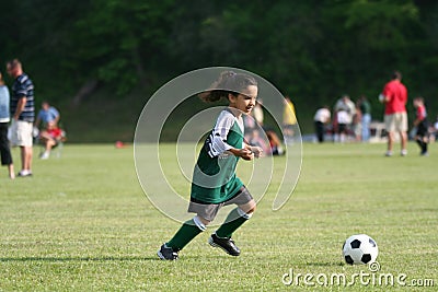 Young Girl Playing Soccer Stock Photo