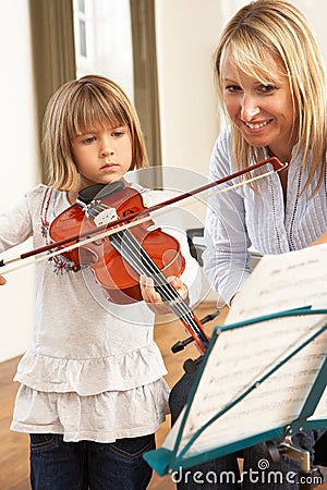 Young girl playing violin Stock Photo