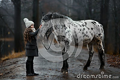 Young girl portrait with Appaloosa horse and Dalmatian dogs Stock Photo