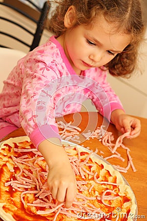 Young girl preparing homemade pizza Stock Photo