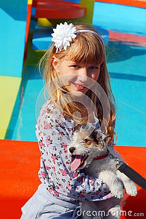 Young girl with puppy outdoor Stock Photo