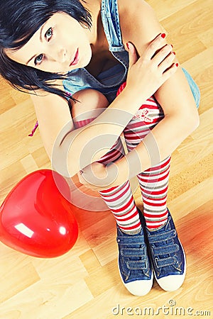 Young girl with red heart balloon Stock Photo