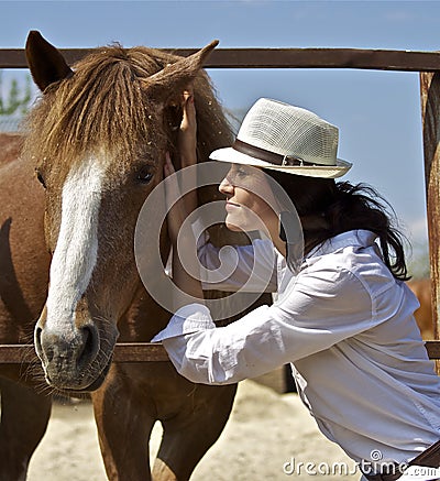 Young girl with the red horse Stock Photo