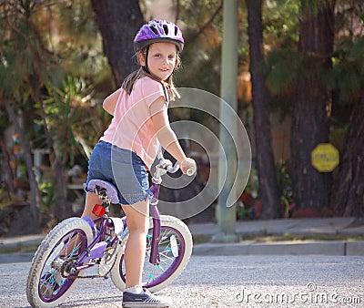 Young girl riding bicycle Stock Photo
