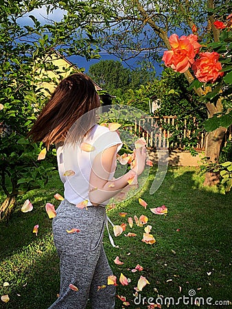 Young girl in the rose garden Stock Photo