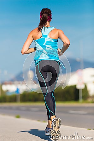 Young girl runner on the street. Editorial Stock Photo