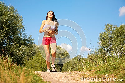 Young girl runs in forest Stock Photo