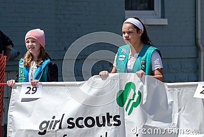 Young girl scouts with banner Editorial Stock Photo