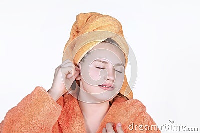 Young girl scratch ears using a cotton swab. Expressing enjoyment on face Stock Photo