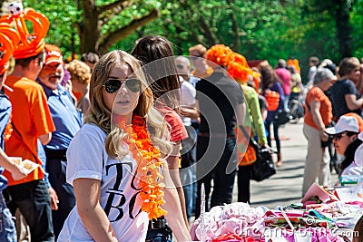 Young girl selling - Koninginnedag 2012 Editorial Stock Photo