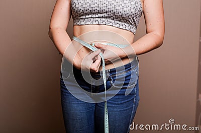 Young girl shows her obesity Stock Photo