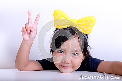 Young girl shows peace hand sign Stock Photo