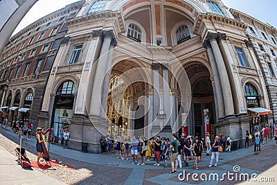 Young girl singing at harp on Piazza della Scala, Milan, Italy Editorial Stock Photo