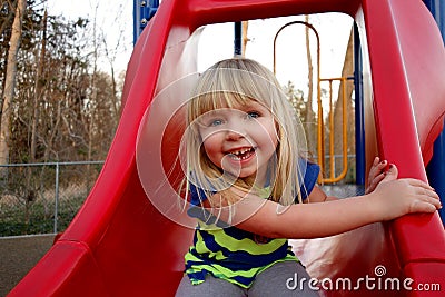 Young girl on slide Stock Photo