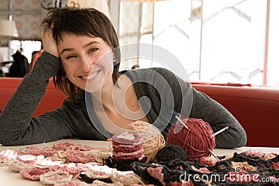 Young girl smiling and crochet scarf Stock Photo