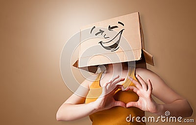 Young girl with happy cardboard box face Stock Photo